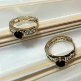 Huggie Acento Negro Chapa